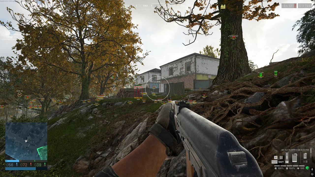 WARDOGS wallhack gameplay showing distant player markers around buildings and wooded terrain